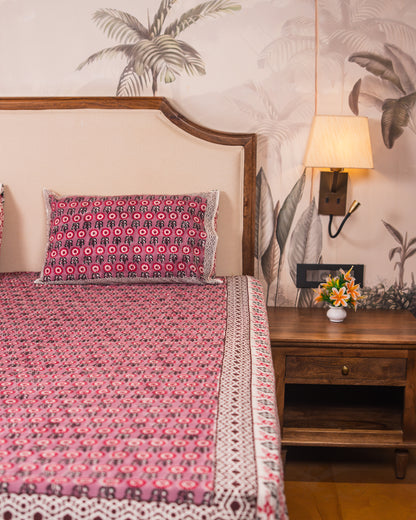 Berry Courtyard bedsheet border detail with coordinated Jaipur block print design.