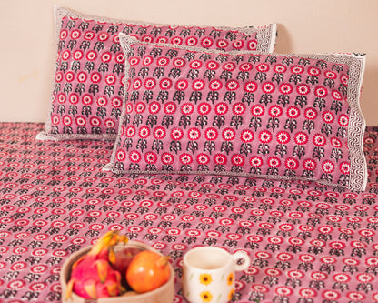 Berry Courtyard Jaipur Block Print Cotton Bedsheet styled in a warm and inviting bedroom setting.