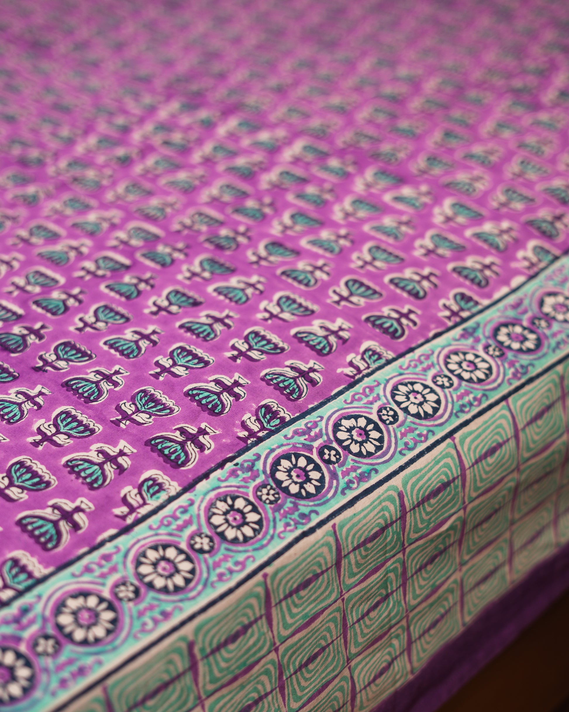 Lilac Bloom cotton bedsheet border detail with coordinated floral Jaipur block print design.
