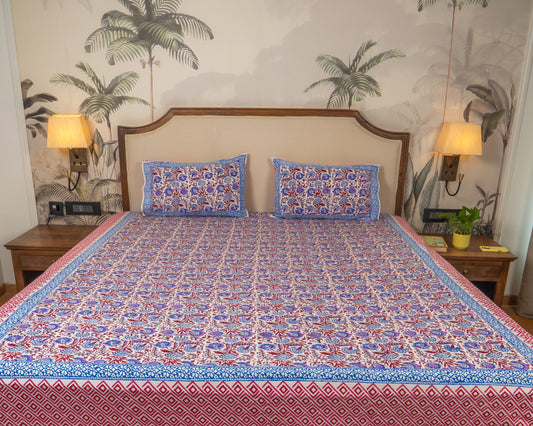 Thakurain Aangan Jaipur Block Print Cotton Bedsheet featuring rich botanical motifs and jewel-toned floral patterns.
