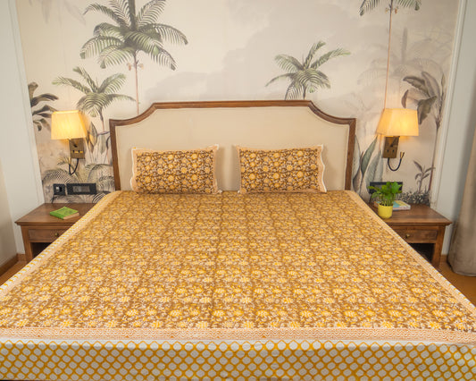 Morning Marigold Jaipur Block Print Cotton Bedsheet featuring warm golden floral motifs on a light base.