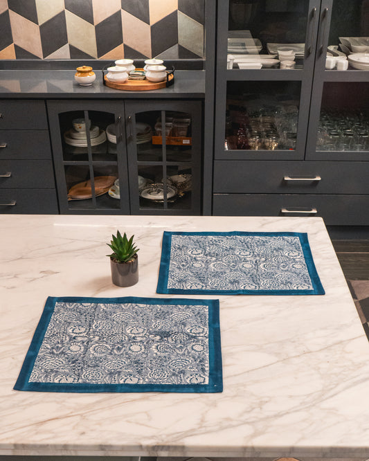 Poonam Bagh Jaipur Block Print Cotton Placemats Set of 2 featuring soft blue-grey floral motifs on a light base.